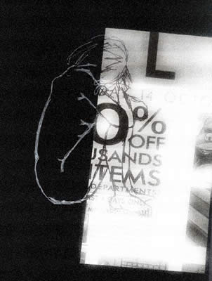 black and white cut advert froma newpaper with sketch of female figure hugging her knees drawn over